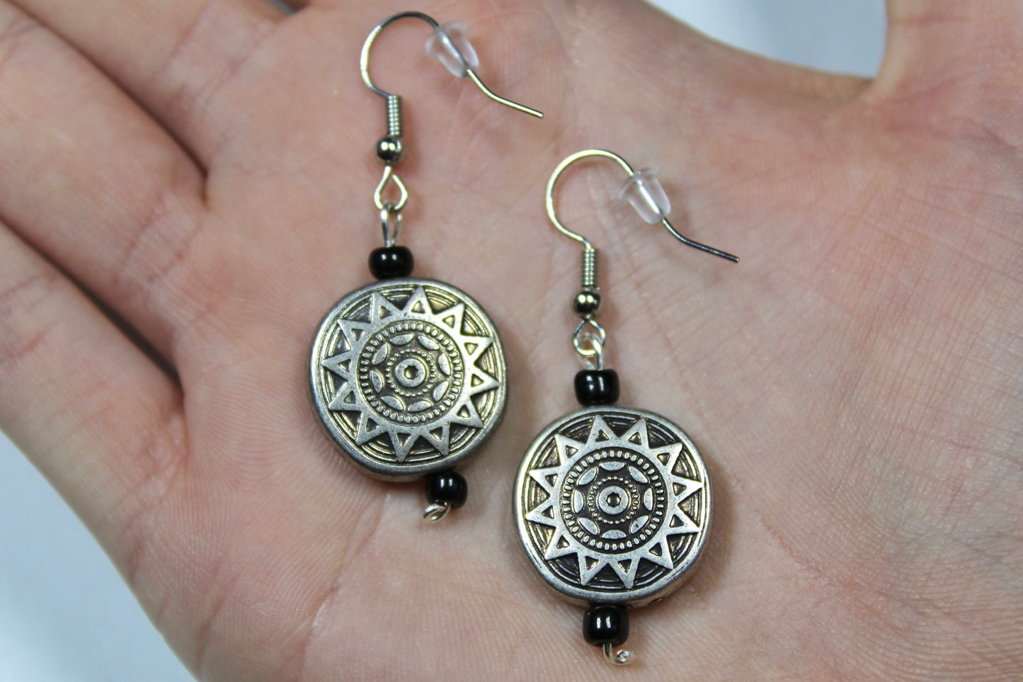 Silver Sun Dangle Earrings With Black Detailing Beads